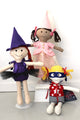 Dolls wearing Witch, Princess, Superhero outfits featured in the  Make a Friend Dress Up Clothes Sewing Pattern by Jennifer Jangles