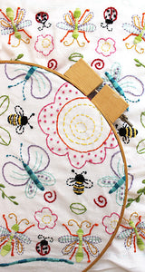 Embroidery Pattern - Flowers and Insects by Jennifer Jangles, displayed in an embroidery