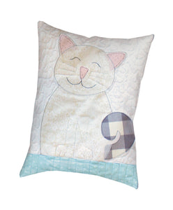 Finished cat accent pillow made using a quilt block from the Cats and Canaries Applique Quilt Sewing Pattern by Jennifer Jangles