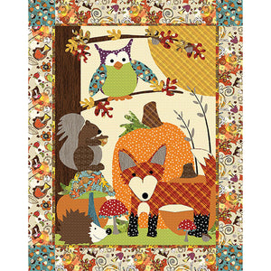 A Walk in the Woods Quilt Sewing Pattern by Jennifer Jangles featuring an appliquéd owl, squirrel, fox, pumpkin, hedgehog, and mushrooms. 