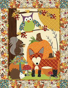 A Walk in the Woods Quilt Sewing Pattern by Jennifer Jangles featuring an appliquéd owl, squirrel, fox, pumpkin, hedgehog, and mushrooms. 
