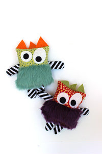 Turquoise + purple fuzzy monsters featured in the Mix n Match Monsters Sewing Pattern by Jennifer Jangles