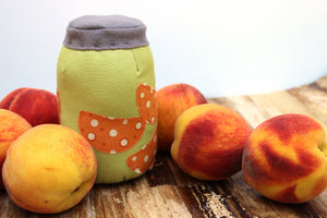 Peaches in a jar pincushion included in the Farmer's Market Mason Jars Pin Cushion Sewing Pattern by Jennifer Jangles
